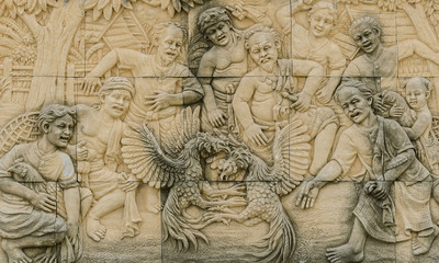 Fototapeta na wymiar Thai rural cockfighting stone carving