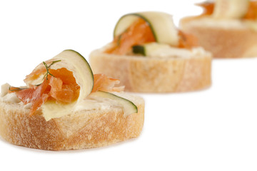 slices of fresh bread with smoked salmon and cucumber