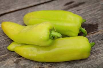 Green pepper stack, on wooden surface