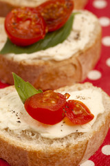 delicious bread slices with butter spread and tomato slices