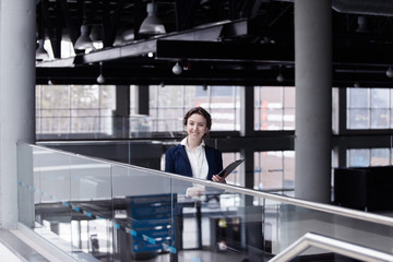 young pleasant business woman at the enterprise