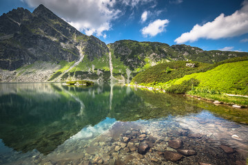 Fototapeta na wymiar Green water mountain lake Morskie Oko, Tatra Mountains, Poland