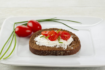 cream and vegetables on bread