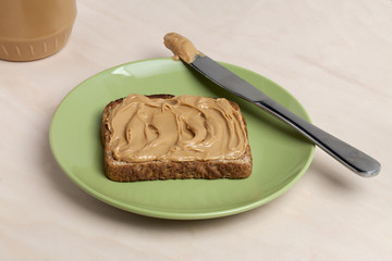 slice of bread with a peanut butter spread