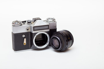 Fototapeta premium vintage film camera with lens detached and body