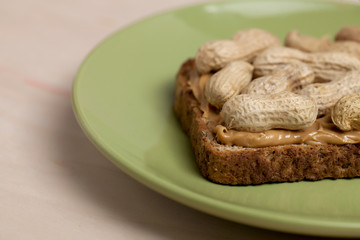 a plate with peanut butter sandwich