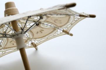 Fototapeta na wymiar Belgian souvenir in the form of an umbrella with Belgian lace 