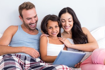 Happy family in their bedroom