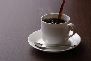 hot coffee on wooden table