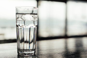 Glass of ice water on the table