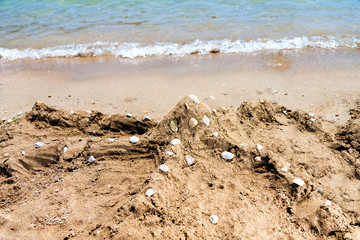 Kolymbia beach with octopus from sand