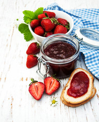 Strawberry jam and fresh strawberries