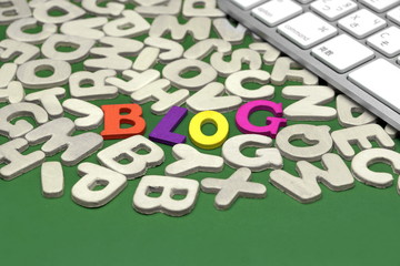 Blog Sign On Green Background With Different Letters And Keyboard