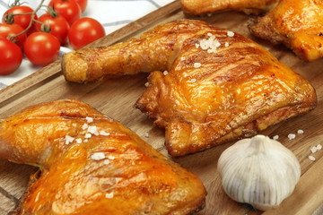 Three Grilled BBQ Chicken Leg Quarter On Wood Board