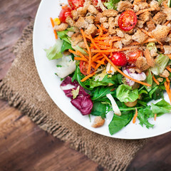 Healthy Salad with arugula, tomatoes and Croutons. Vegetable sal