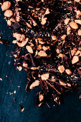 Delicious chocolate pieces on black background