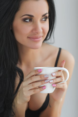 Sexy woman with cup of coffee 