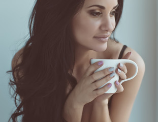 Sexy woman with cup of coffee 