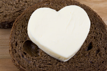 slice of bread with heart shaped butter