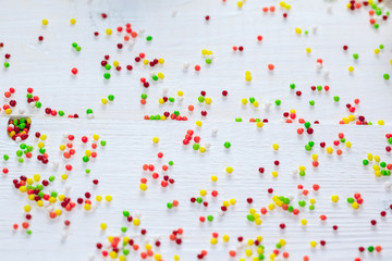 Beautiful colored Easter background with white powder on wooden boards. Free space for text