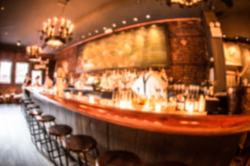Fototapeta na wymiar Defocused blur of cozy restaurant bar with fisheye effect.