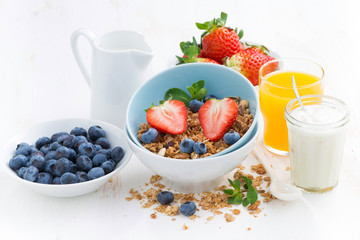 healthy breakfast - granola, fresh berries and milk