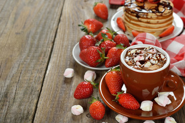 Hot chocolate with marshmallows and strawberries