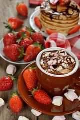 Hot chocolate with marshmallows and strawberries