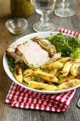 Roasted pork with potato, green salad and mustard