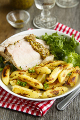 Roasted pork with potato, green salad and mustard