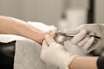 Obraz na płótnie Canvas Close up shot of a pedicure process