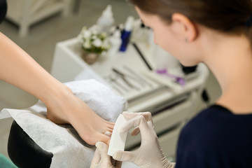 Buff polishing nails in beauty salon pedicure