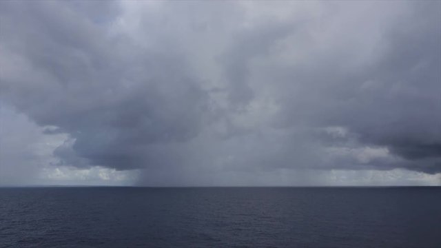Rain clouds on horizon at sea