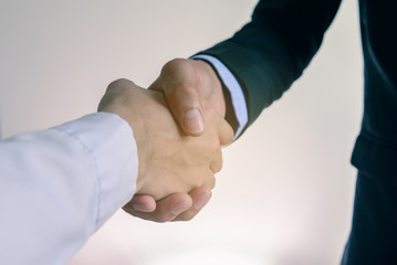 Closeup of businessmans handshake.