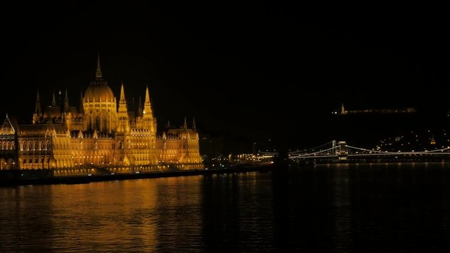 Building of Parliament in Hungarian capital Budapest from Margit bridge 4K 3840X2160 UltraHD footage - Danube river and parliament building in Budapest by the night 4K 2160p UHD video 