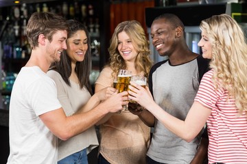 Friends toasting with beer
