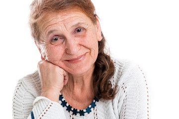 Portrait of a happy old woman on a white background