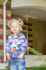 Adorable little child girl. Summer green nature background.  Use it for baby, parenting or love concept