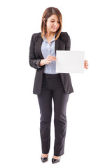 Businesswoman holding a sign