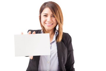 Naklejka premium Businesswoman holding up a sign
