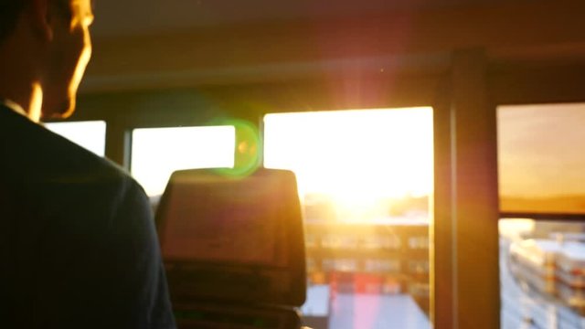 Man in sunflares running on a treadmill. Close-up shot.
