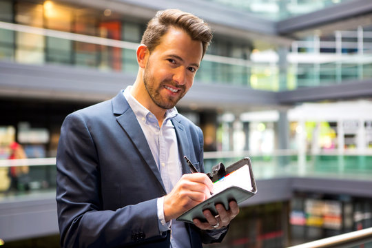 Young attractive man taking a new appointment