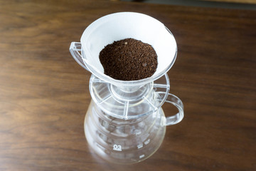 ground coffee beans on paper filter