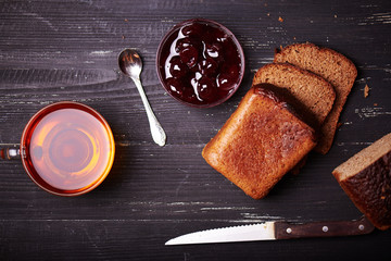 slice of bread with butter and cherry jam