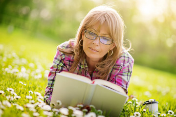 Woman reading outdoors