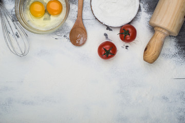 baking ingredients eggs, flour, sugar, butter, yeast. dough preparation. food background