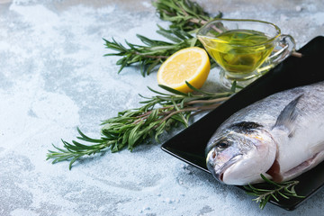 Raw bream fish with herbs