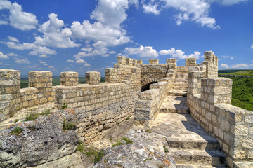Fototapeta na wymiar Stone walls and gate of ancient fortress