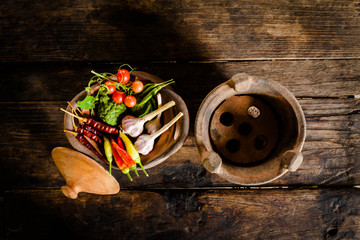 Condiments and spices for creative cooking on dark rustic wooden
