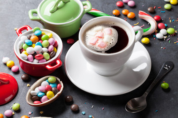 Colorful candies and coffee cup